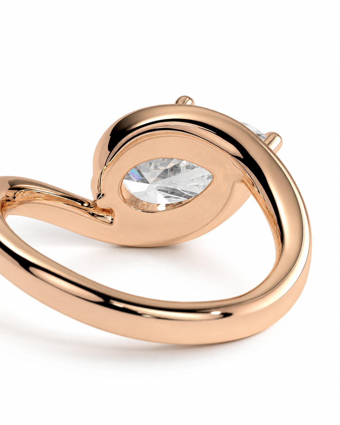 color_10K_RG, color_14K_RG &&
A close-up of a rose gold ring featuring a teardrop-shaped clear gemstone in a polished setting, shown against a clean white background.