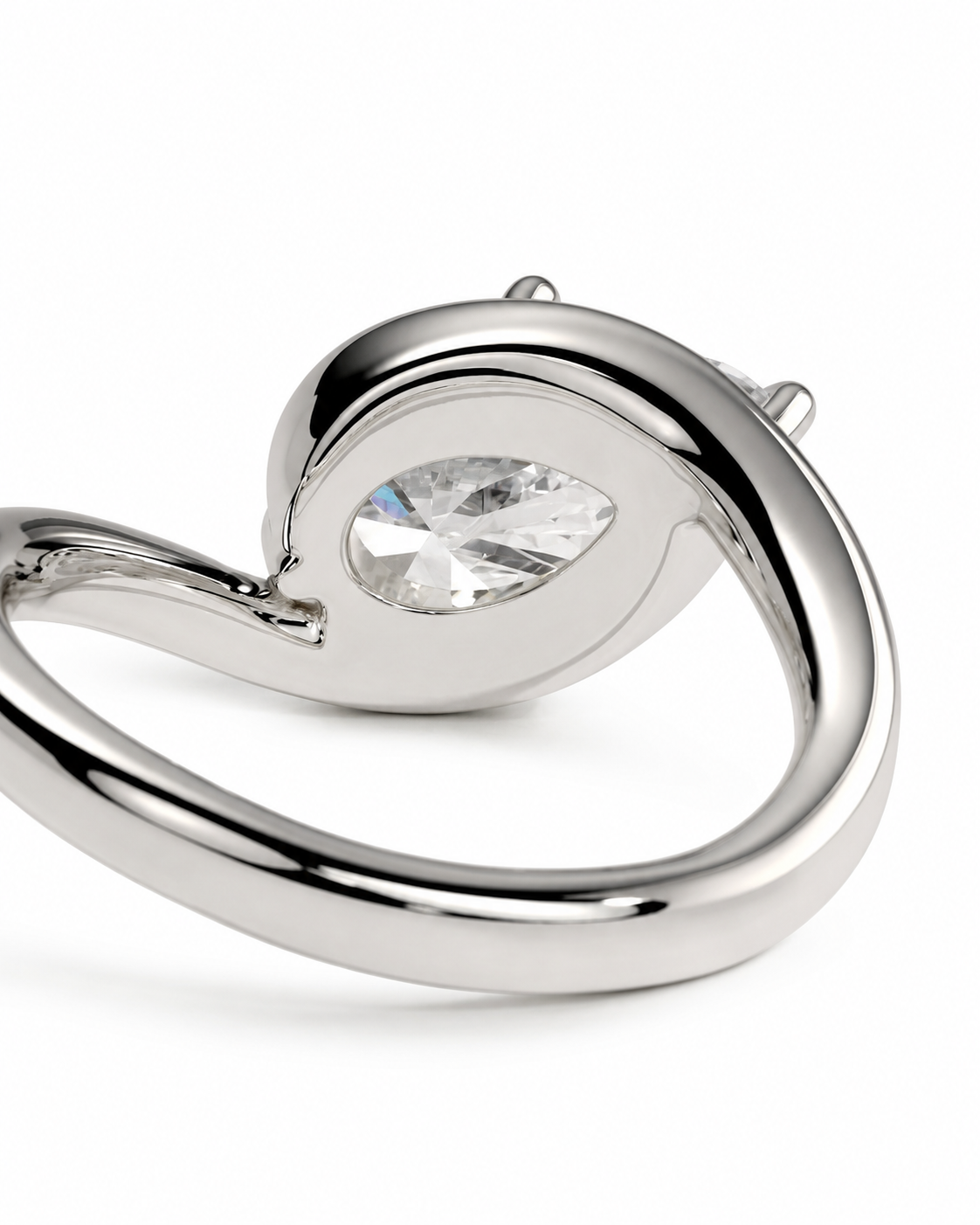 color_925_SIL,color_935_ARG,color_10K_WG, color_14K_WG &&
A polished silver-toned ring featuring a teardrop-shaped clear gemstone in a curved setting, shown on a clean white background.