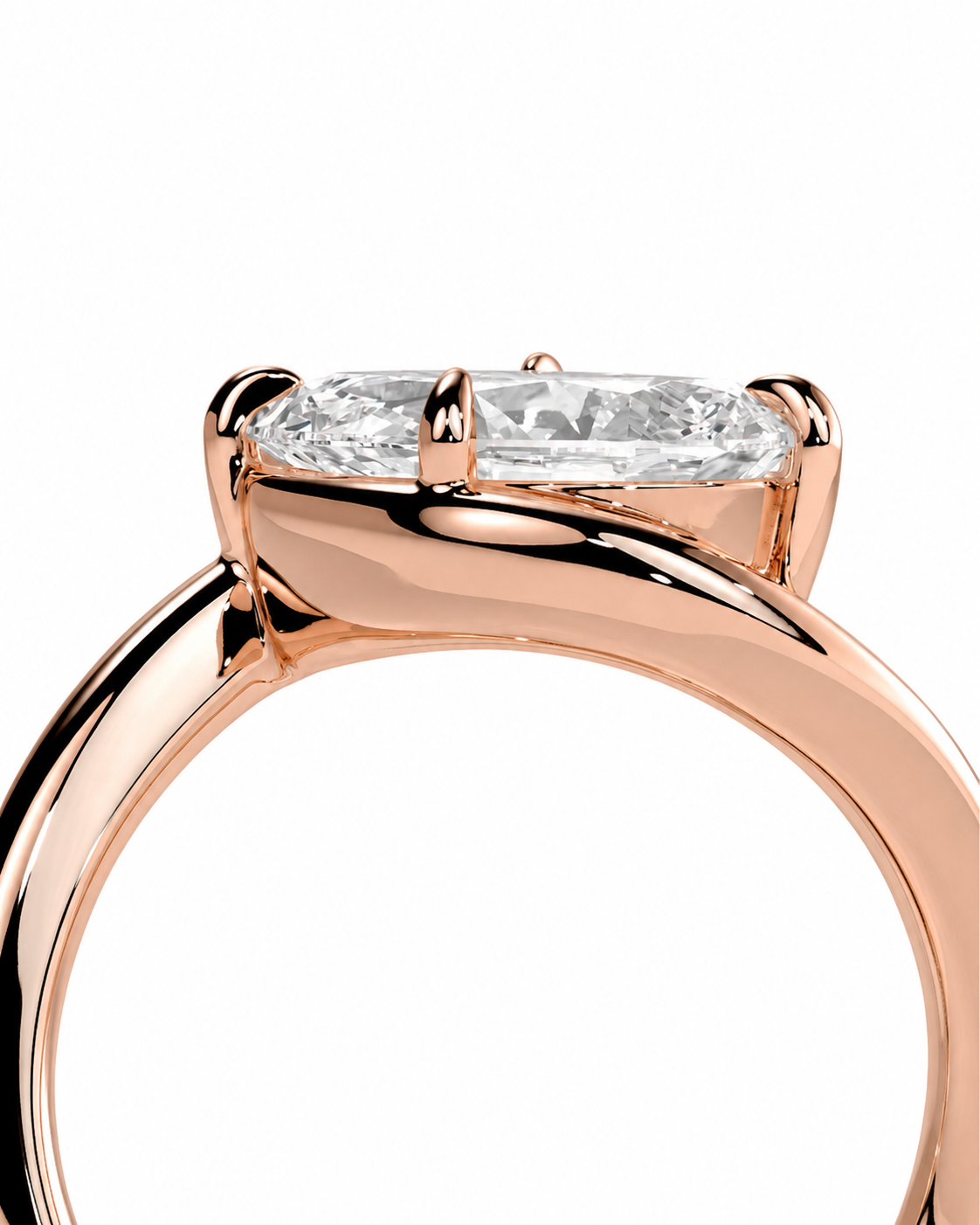 color_10K_RG, color_14K_RG &&
Close-up of a rose gold ring with an oval-cut clear gemstone in a four-prong setting, shown against a plain white background.