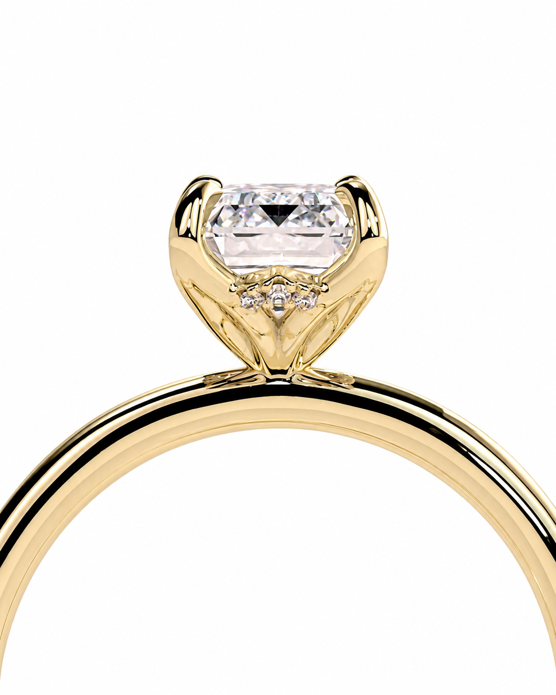 color_10K_YG, color_14K_YG &&
A close-up of a yellow gold solitaire engagement ring featuring a rectangular clear center stone and small accent diamonds on the band, set against a plain white background.