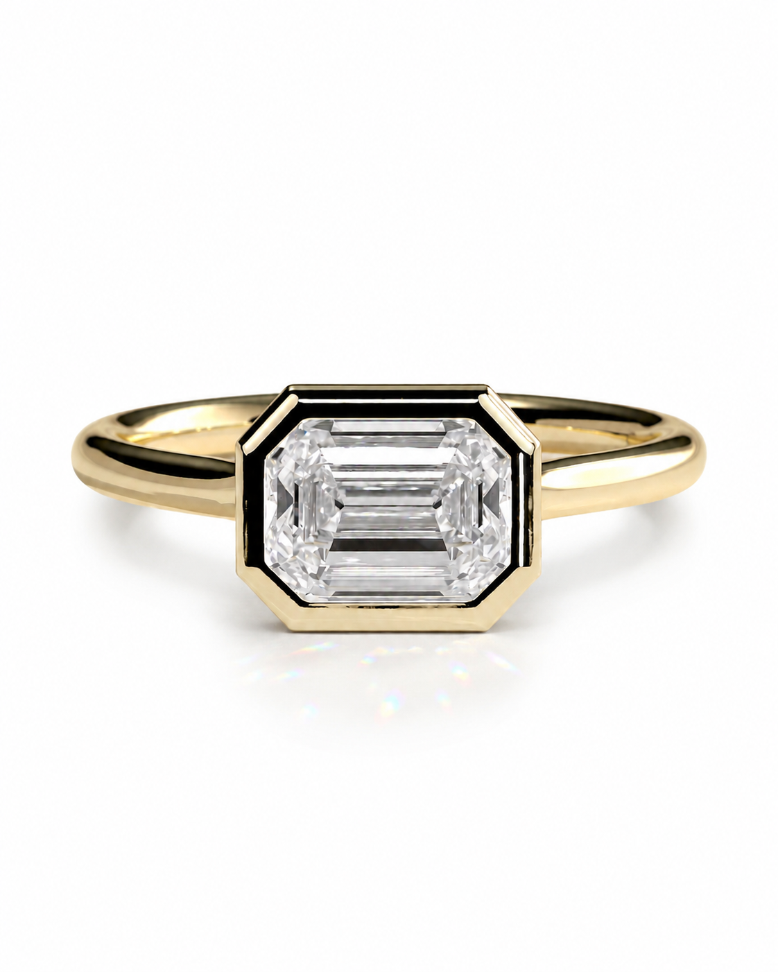 color_10K_YG, color_14K_YG &&	
A yellow gold ring featuring a large rectangular baguette-cut clear gemstone in a beveled octagonal setting, shown on a clean white background.