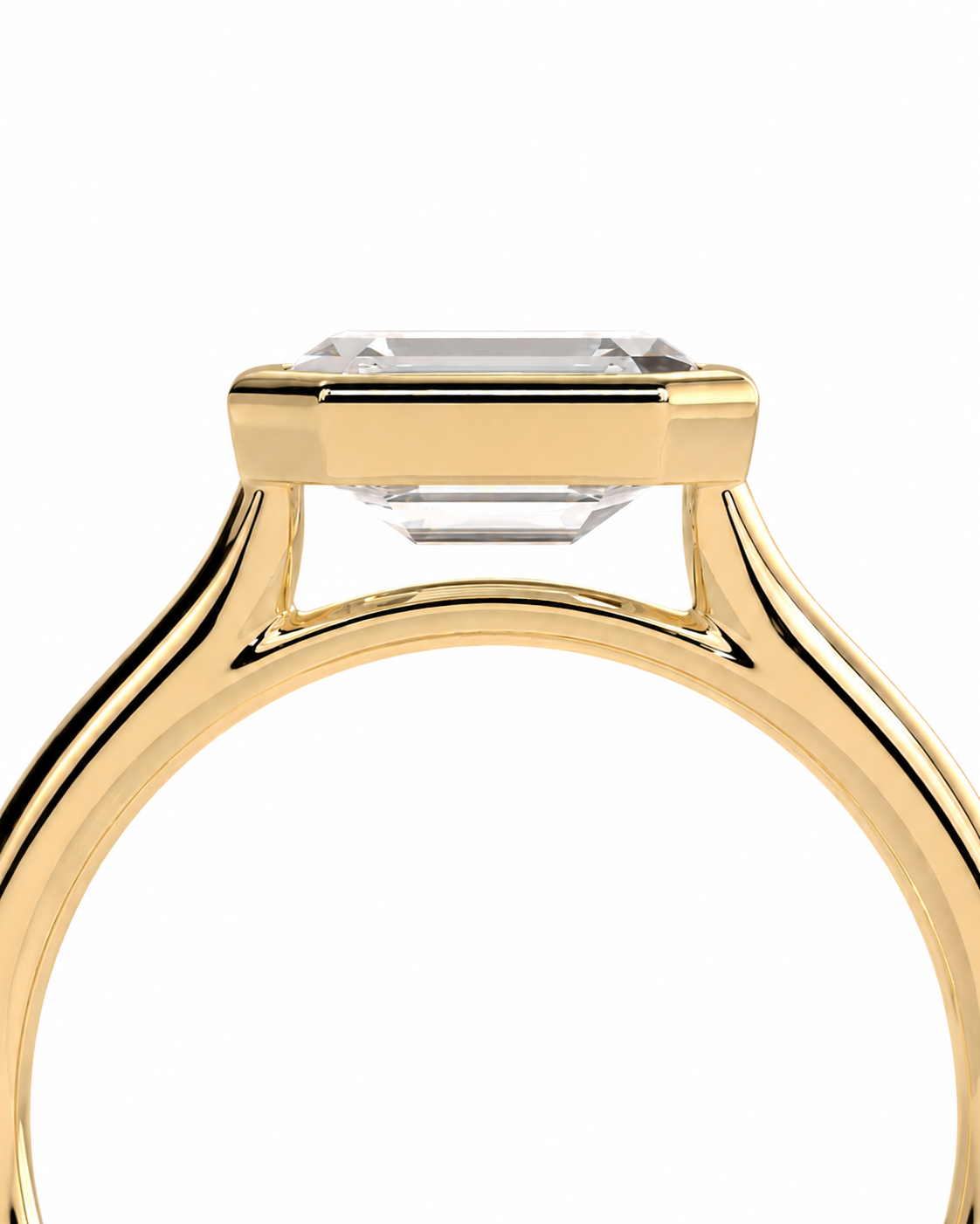 color_10K_YG, color_14K_YG &&	
Close-up of a yellow gold ring setting with a clear rectangular gemstone on a plain white background.