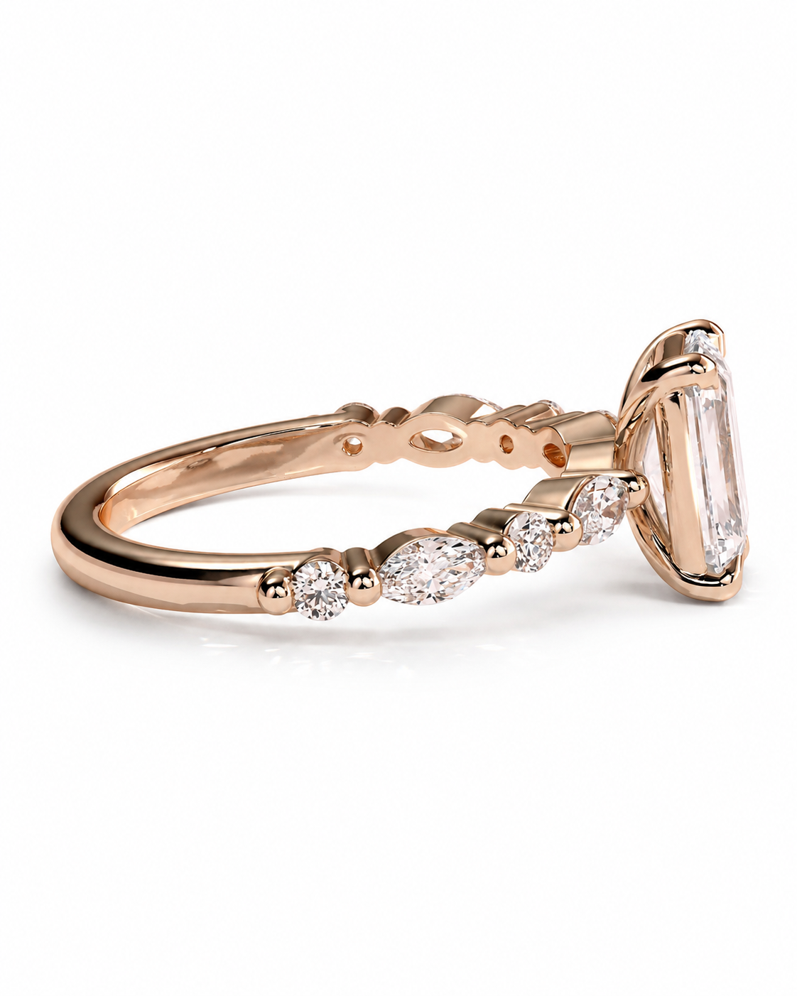 color_10K_RG, color_14K_RG &&	A rose gold ring featuring a large rectangular emerald-cut clear gemstone and smaller marquise and round-cut clear accent stones along the band, shown on a clean white background.