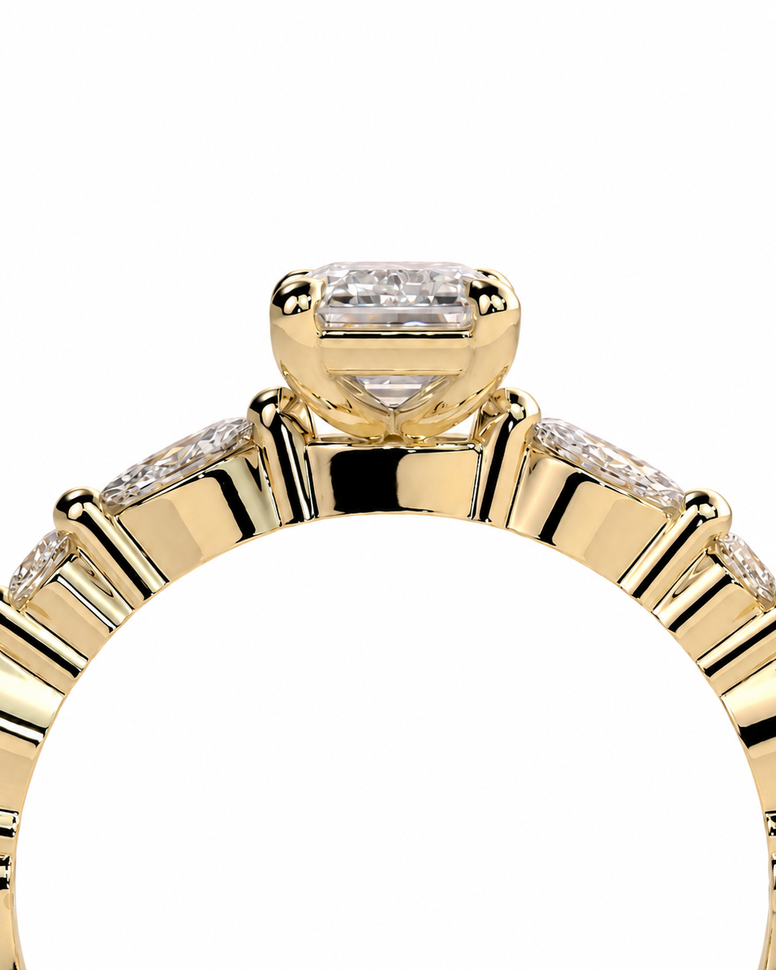 color_10K_YG, color_14K_YG &&	
A close-up of a yellow gold ring featuring a rectangular baguette-cut center stone and channel-set round stones along the band, shown against a plain white background.