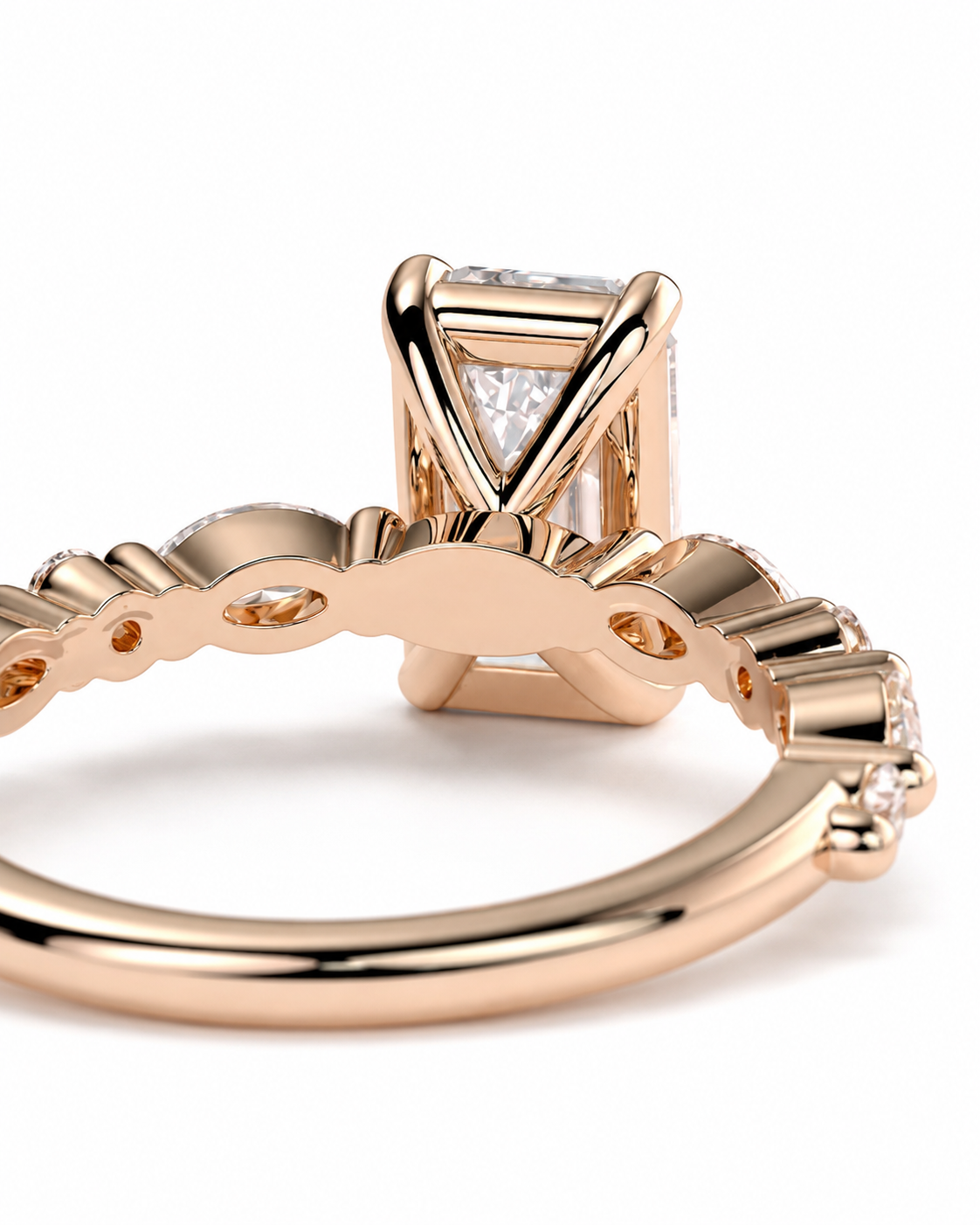 color_10K_RG, color_14K_RG &&	Close-up of a rose gold ring with a triangular bezel setting and clear gemstones, shown on a white background.