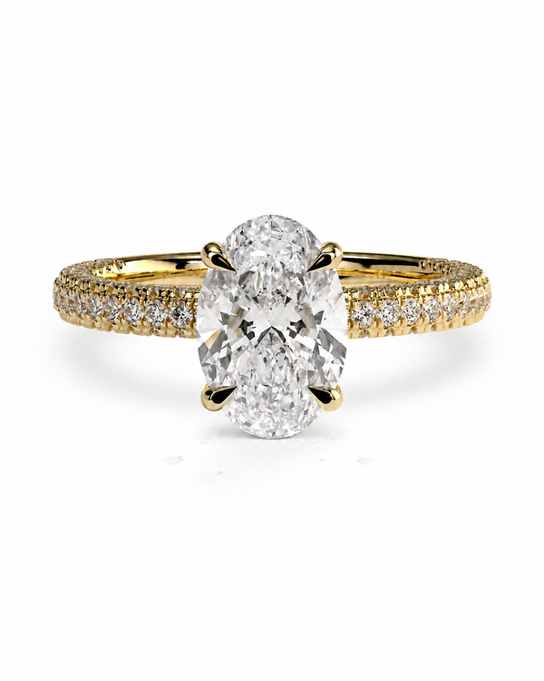 color_10K_YG, color_14K_YG &&	
An oval-cut diamond engagement ring with a yellow gold band paved with small diamonds, shown on a clean white background.