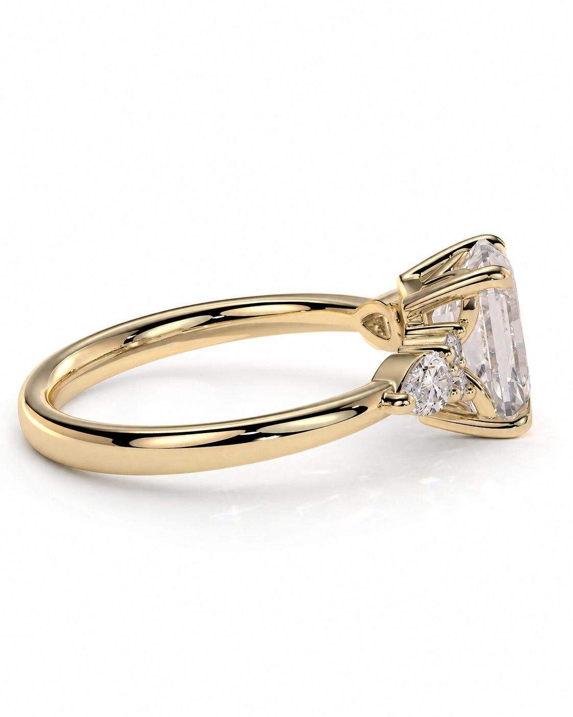color_10K_YG, color_14K_YG &&A yellow gold ring featuring a large rectangular clear gemstone in a prong setting, with smaller accent stones on the band, shown on a clean white background.