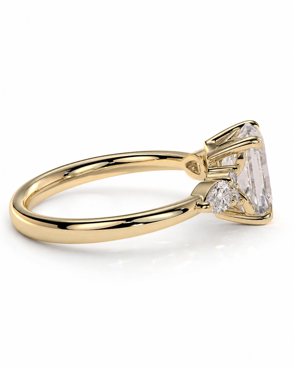 color_10K_YG, color_14K_YG &&A yellow gold ring featuring a large rectangular clear gemstone in a prong setting, with smaller accent stones on the band, shown on a clean white background.