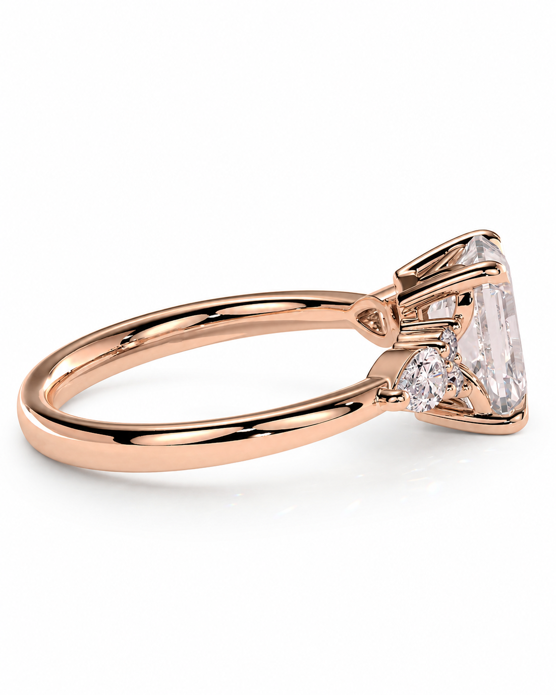 color_10K_RG, color_14K_RG &&Rose gold diamond ring with a large emerald-cut center stone and a smaller round diamond accent, shown on a clean white background.