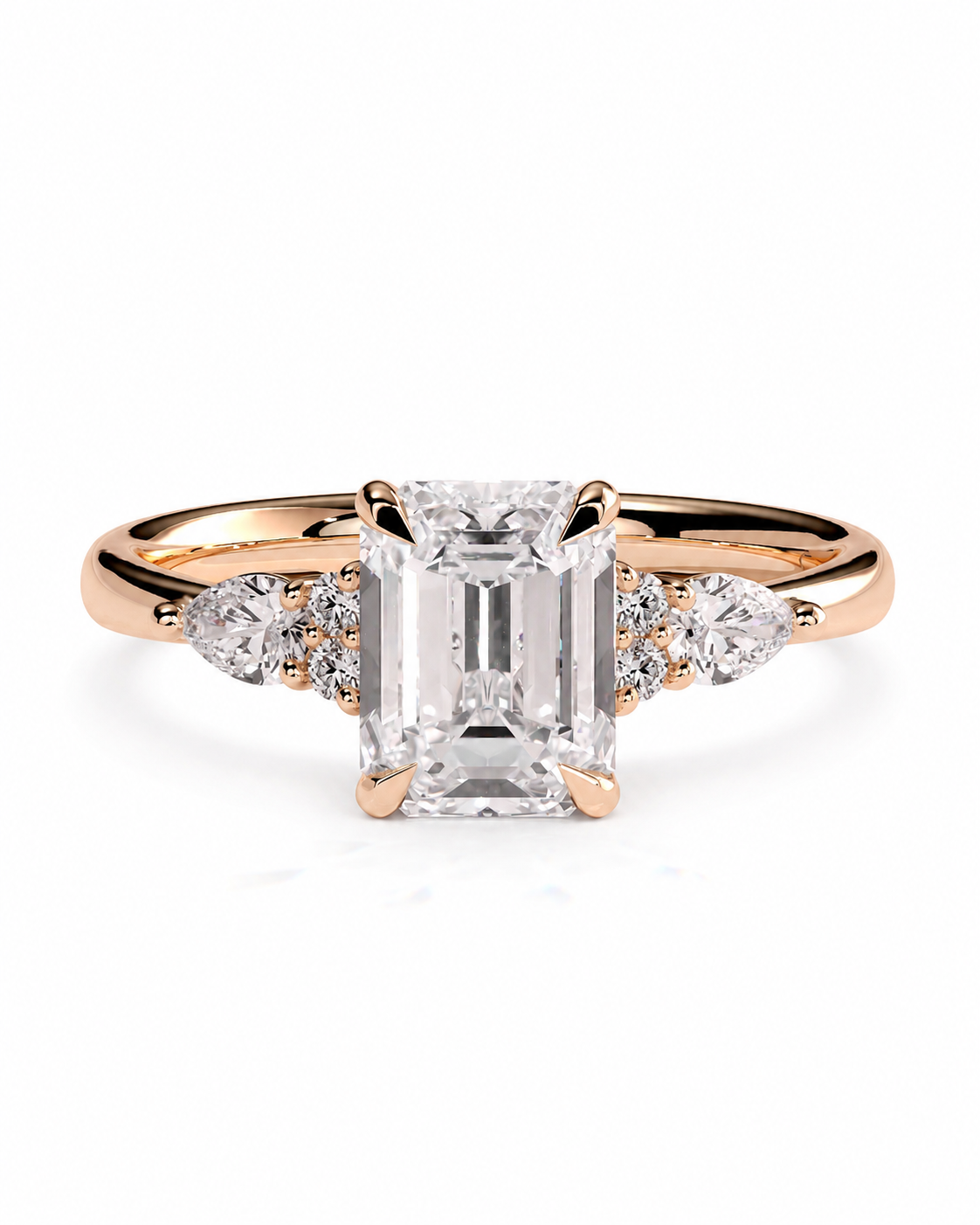 color_10K_RG, color_14K_RG &&A rose gold engagement ring featuring a large emerald-cut center stone and smaller round and marquise side stones, set against a clean white background.