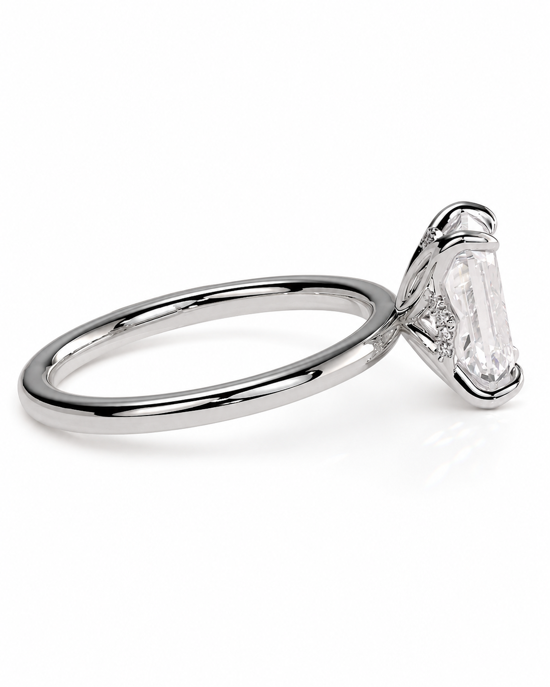 color_925_SIL,color_935_ARG,color_10K_WG, color_14K_WG &&
A silver-toned ring featuring a large clear baguette-cut center stone in a prong setting, with small clear accent stones along the band, shown on a white background.