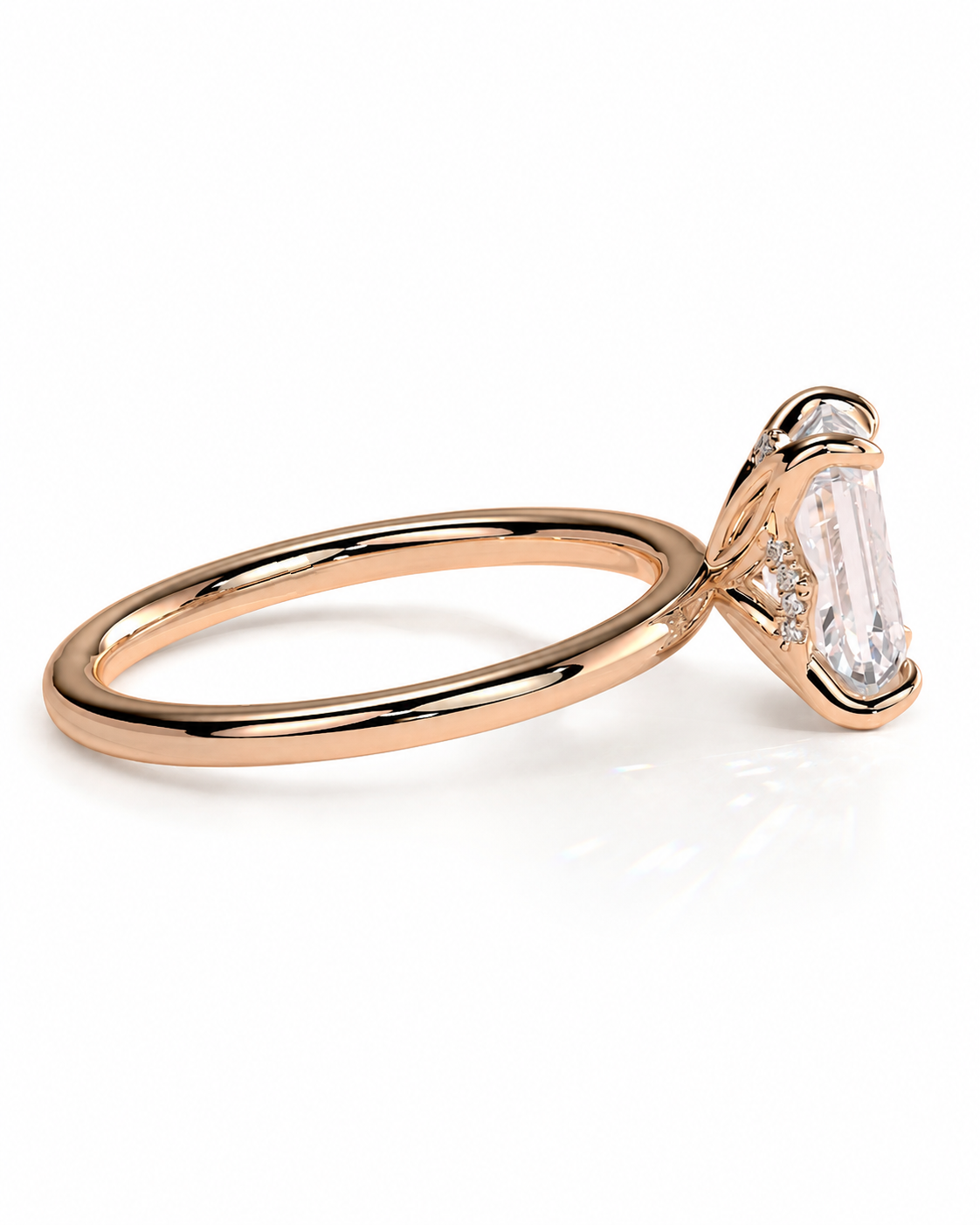 color_10K_RG, color_14K_RG &&
A rose gold engagement ring featuring a large baguette-cut clear center stone in a three-prong setting, with small accent diamonds on the shoulders, shown on a clean white background.
