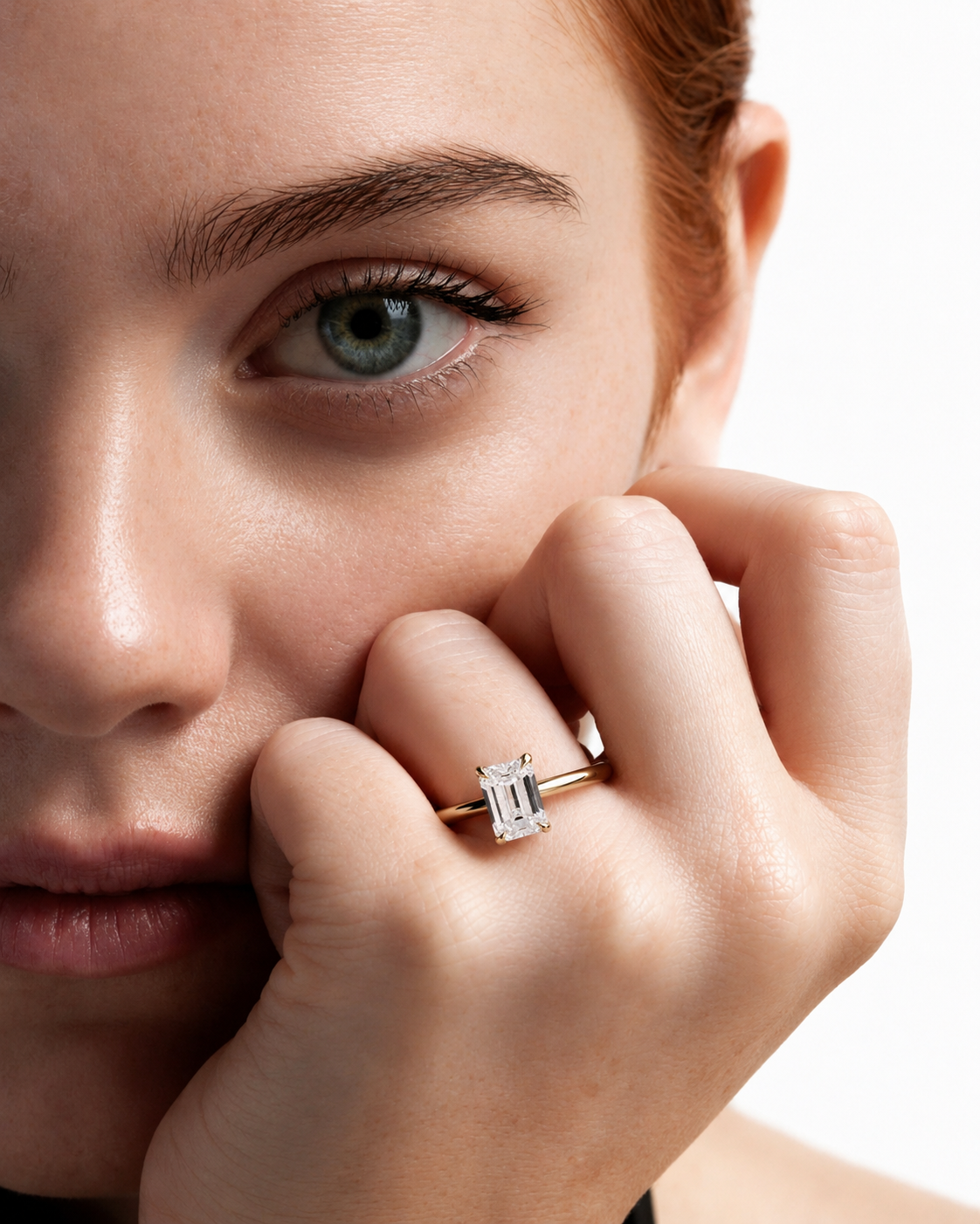 color_10K_YG, color_14K_YG &&
A close-up lifestyle shot of a model wearing a silver ring with a rectangular baguette-cut clear gemstone on her finger, set against a clean white background.