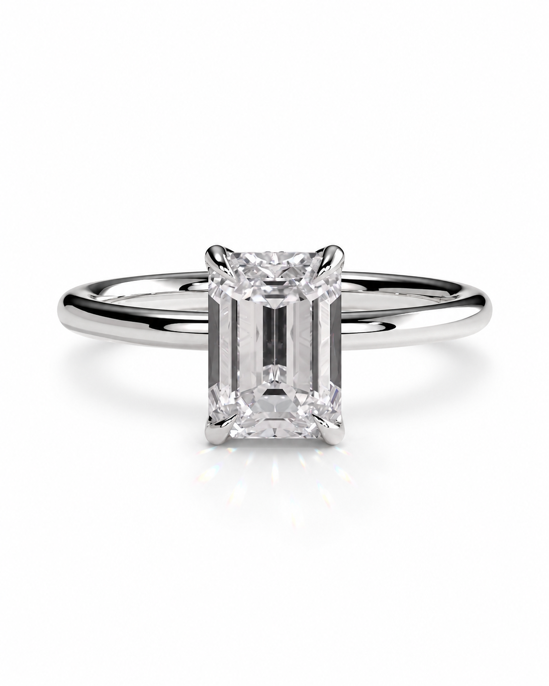 color_925_SIL,color_935_ARG,color_10K_WG, color_14K_WG &&
An emerald-cut diamond engagement ring with a polished silver-colored band, shown on a clean white background with a soft reflection.