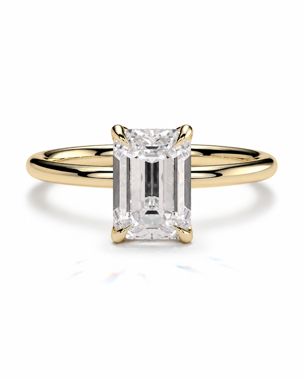 color_10K_YG, color_14K_YG &&
An emerald-cut diamond engagement ring with a yellow gold band, shown on a clean white background.