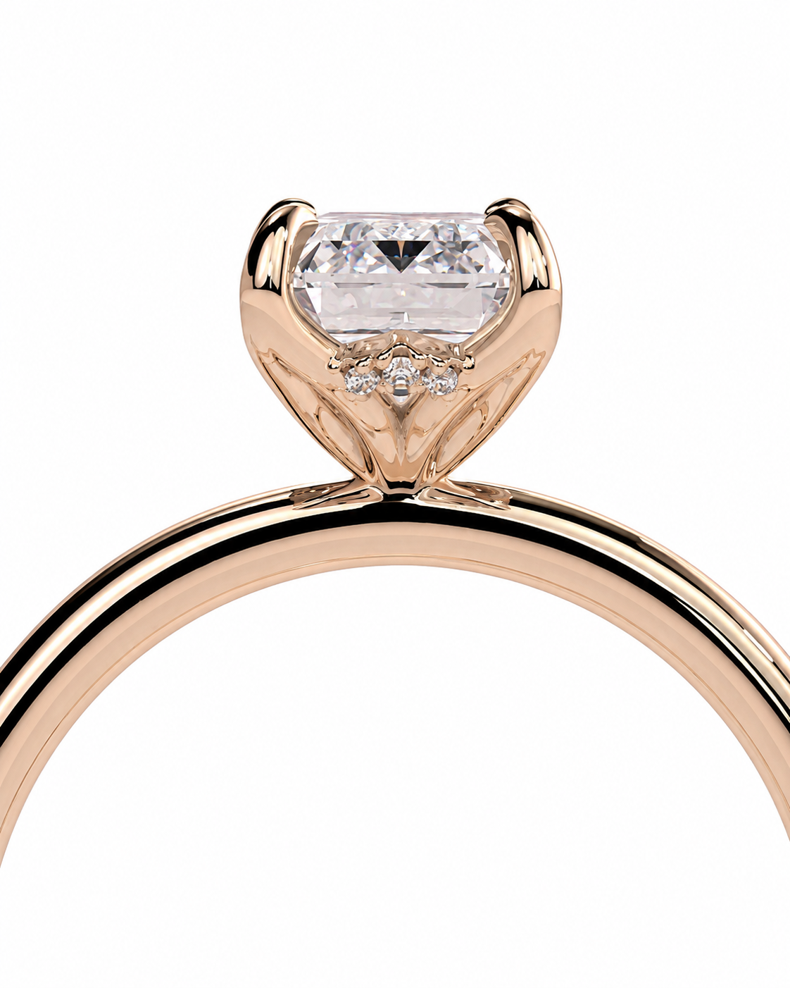 color_10K_RG, color_14K_RG &&
Rose gold solitaire engagement ring with a marquise-cut clear center stone and small accent diamonds, shown on a white background.