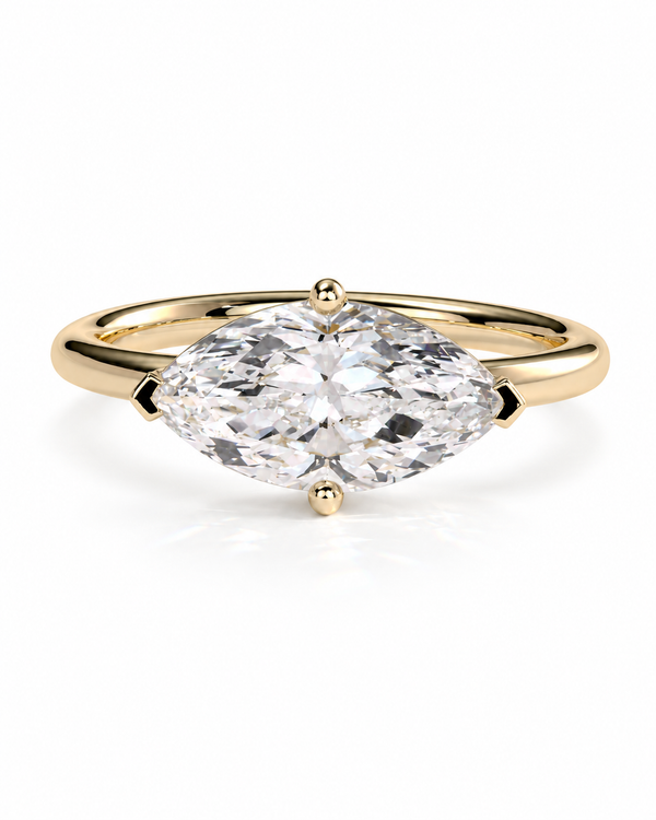color_10K_YG, color_14K_YG &&A yellow gold ring featuring a large marquise-cut clear gemstone in a four-prong setting, shown against a clean white background.