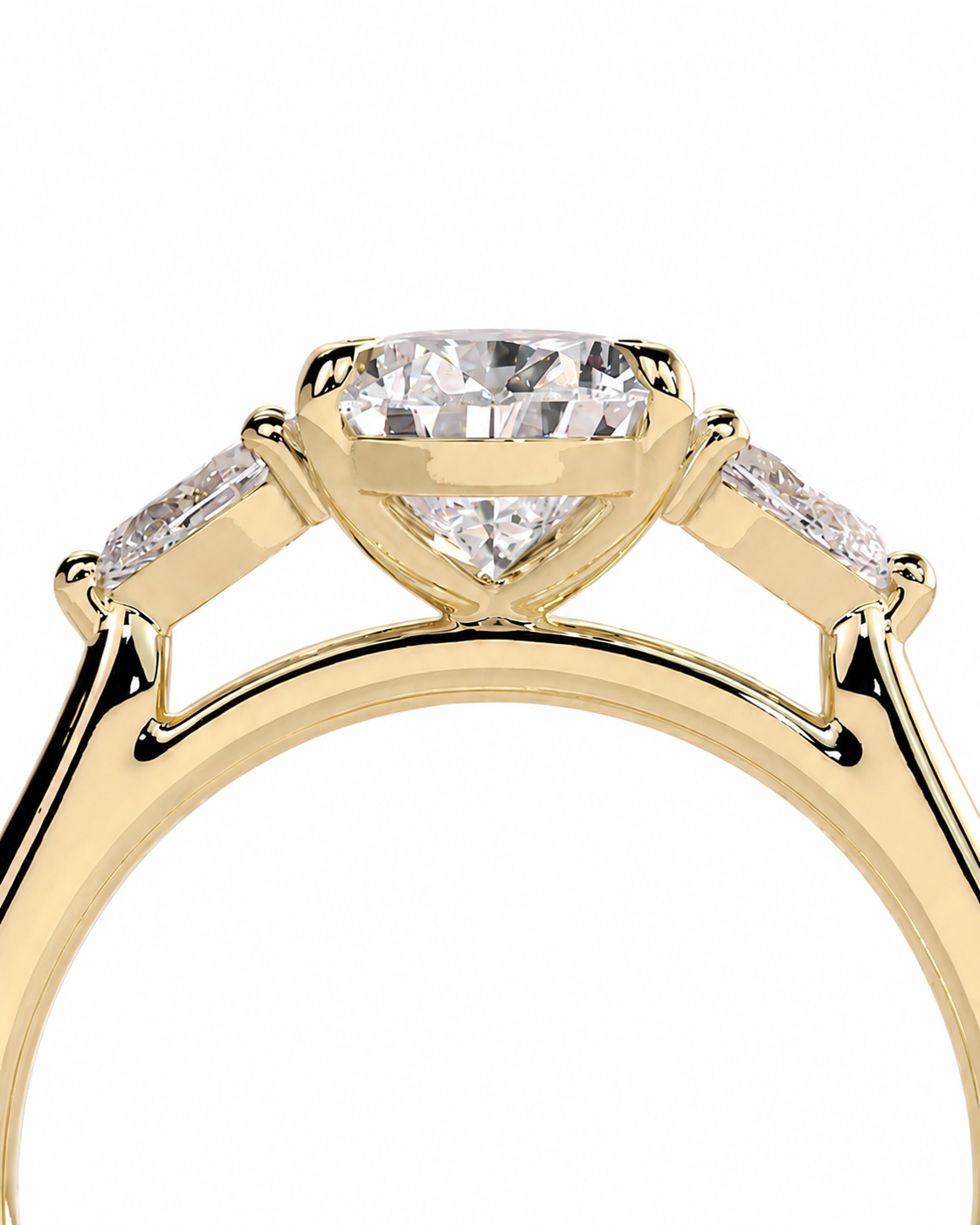 color_10K_YG, color_14K_YG &&A close-up of a yellow gold ring featuring a marquise-cut center diamond flanked by two baguette-cut side diamonds, set against a plain white background.