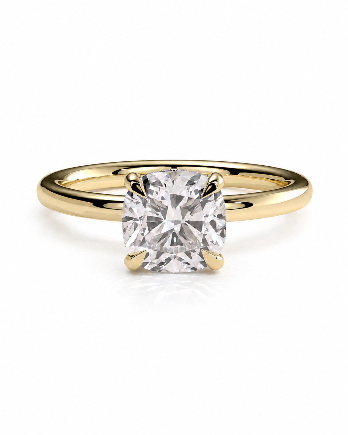 color_10K_YG, color_14K_YG &&A yellow gold solitaire engagement ring featuring a cushion-cut diamond in a four-prong setting, shown on a clean white background.