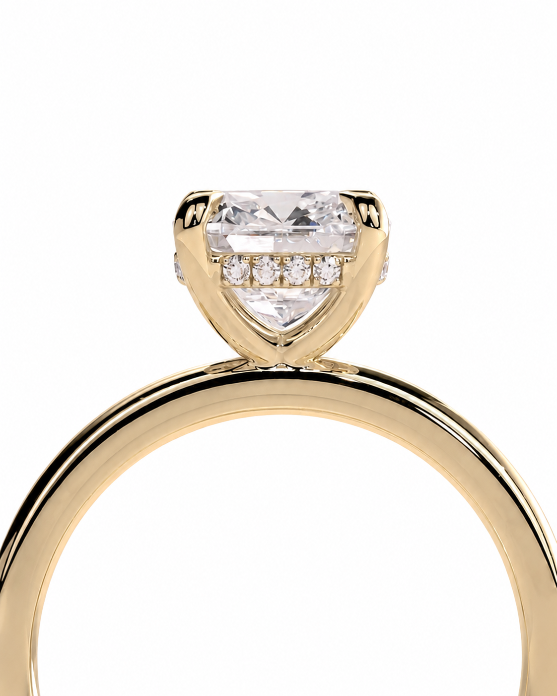 color_10K_YG, color_14K_YG &&A close-up shot of a yellow gold ring featuring a heart-shaped clear gemstone in a prong setting with smaller accent stones on the band, set against a plain white background.