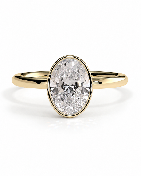 color_10K_YG, color_14K_YG &&An oval diamond engagement ring with a yellow gold band, shown on a clean white background.