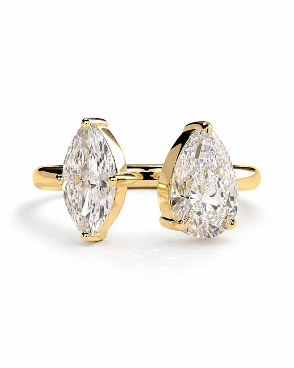 color_10K_YG, color_14K_YG &&A yellow gold ring featuring two marquise-cut diamonds on a split shank, photographed on a clean white background.