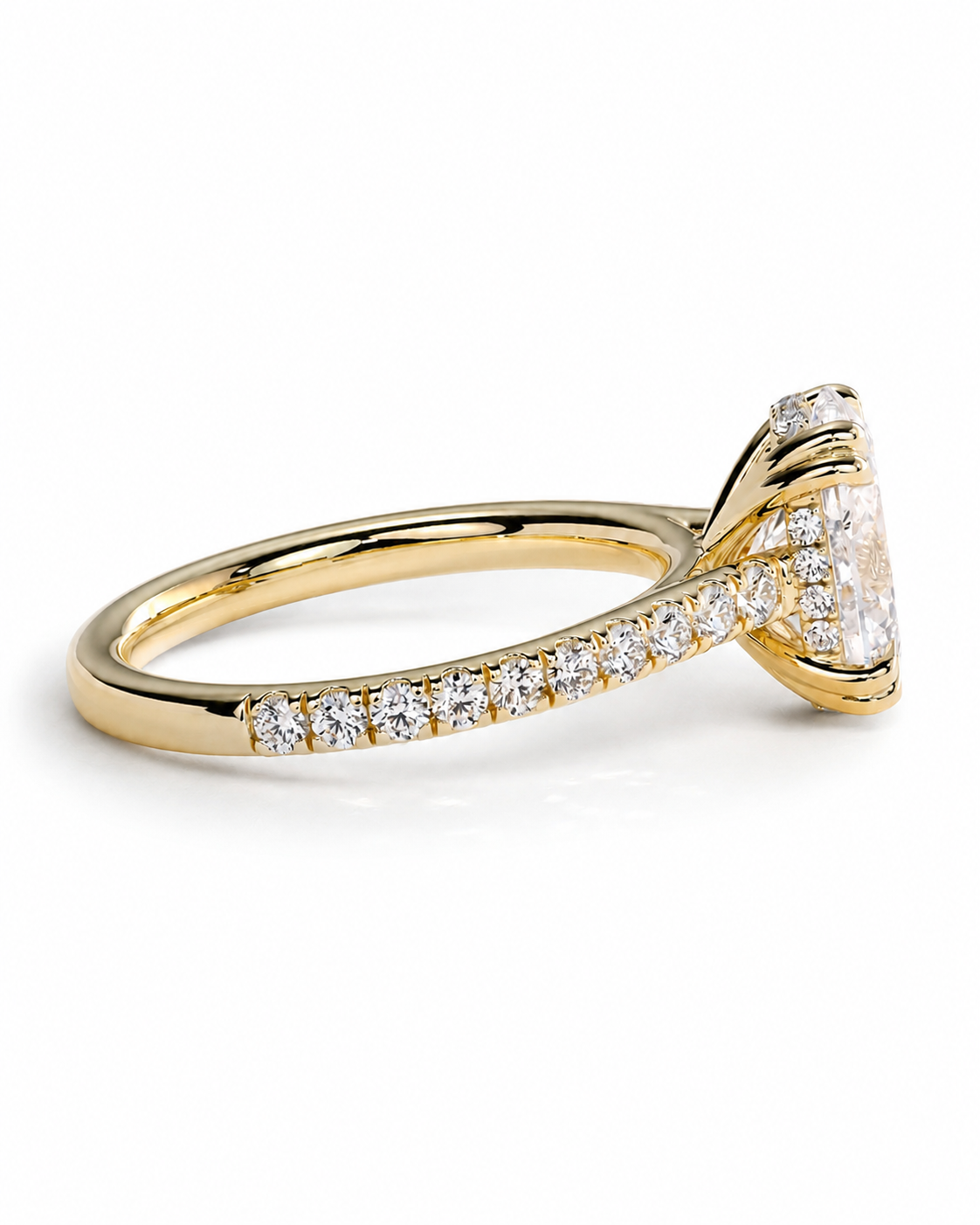 color_10K_YG, color_14K_YG &&A yellow gold diamond ring with a marquise-cut center stone and pavé-set diamonds along the band, shown on a clean white background.