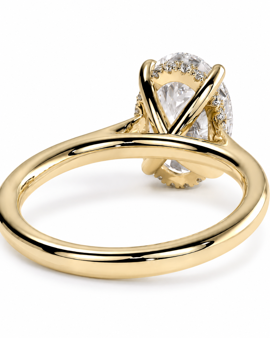 color_10K_YG, color_14K_YG &&A yellow gold ring with a large oval-cut clear gemstone in a prong setting, accented by smaller side stones, shown on a plain white background.
