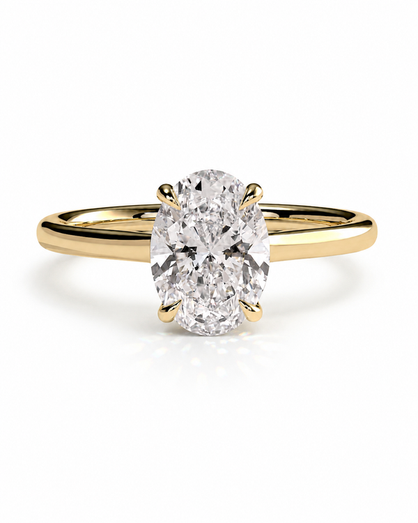 color_10K_YG, color_14K_YG &&An oval-cut diamond engagement ring with a yellow gold band, shown on a clean white background.