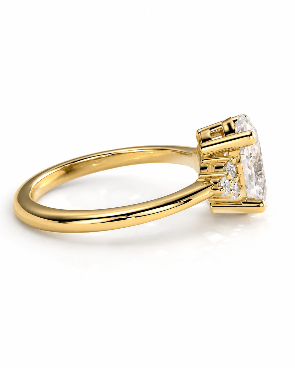 color_10K_YG, color_14K_YG &&A yellow gold ring with a large oval-cut clear gemstone and smaller side stones, shown on a clean white background.
