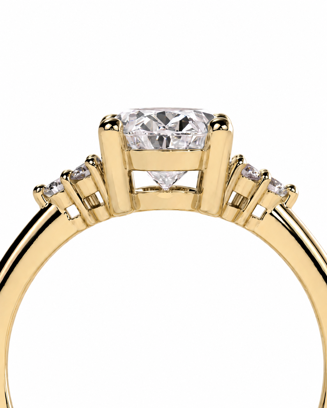 color_10K_YG, color_14K_YG &&A close-up shot of a yellow gold ring featuring a large round brilliant-cut center stone and smaller side stones on a clean white background.