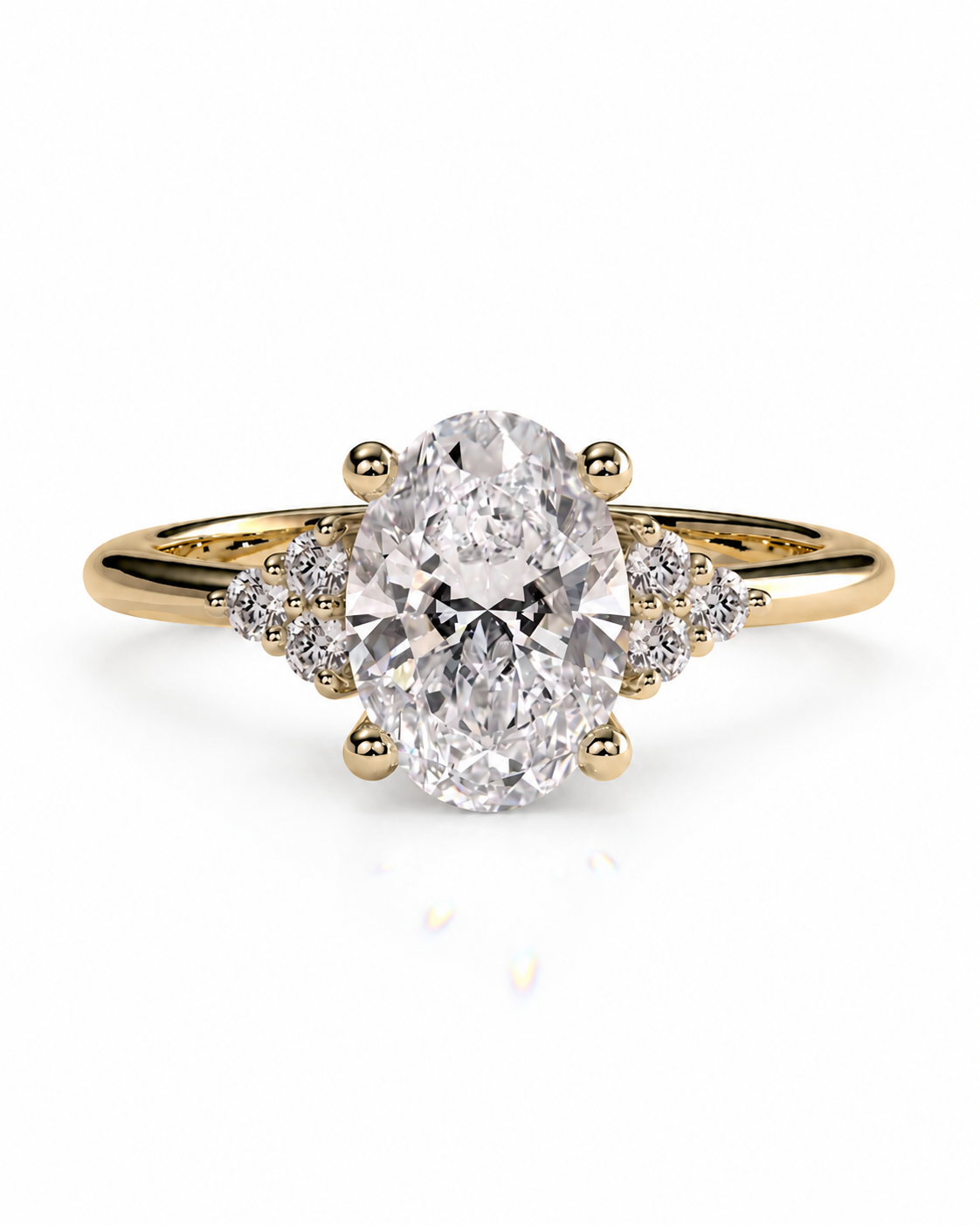 color_10K_YG, color_14K_YG &&An oval diamond engagement ring with a yellow gold band, featuring a central oval-cut diamond set in a four-prong setting with small accent diamonds on the shoulders, shown on a white background.