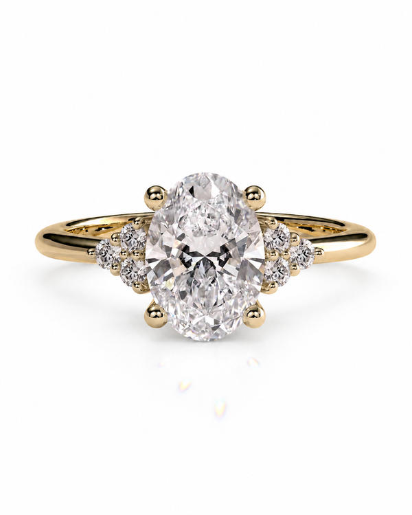 color_10K_YG, color_14K_YG &&An oval diamond engagement ring with a yellow gold band, featuring a central oval-cut diamond set in a four-prong setting with small accent diamonds on the shoulders, shown on a white background.