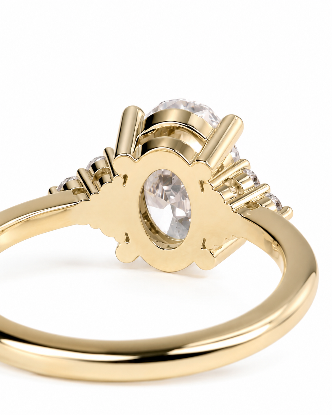 color_10K_YG, color_14K_YG &&A close-up of a yellow gold ring featuring a large oval clear center stone and smaller side stones, shown on a clean white background.