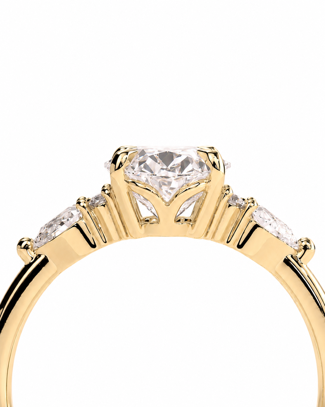color_10K_YG, color_14K_YG &&A close-up of a yellow gold ring featuring a large round brilliant-cut center stone and three marquise-cut side stones, set against a plain white background.