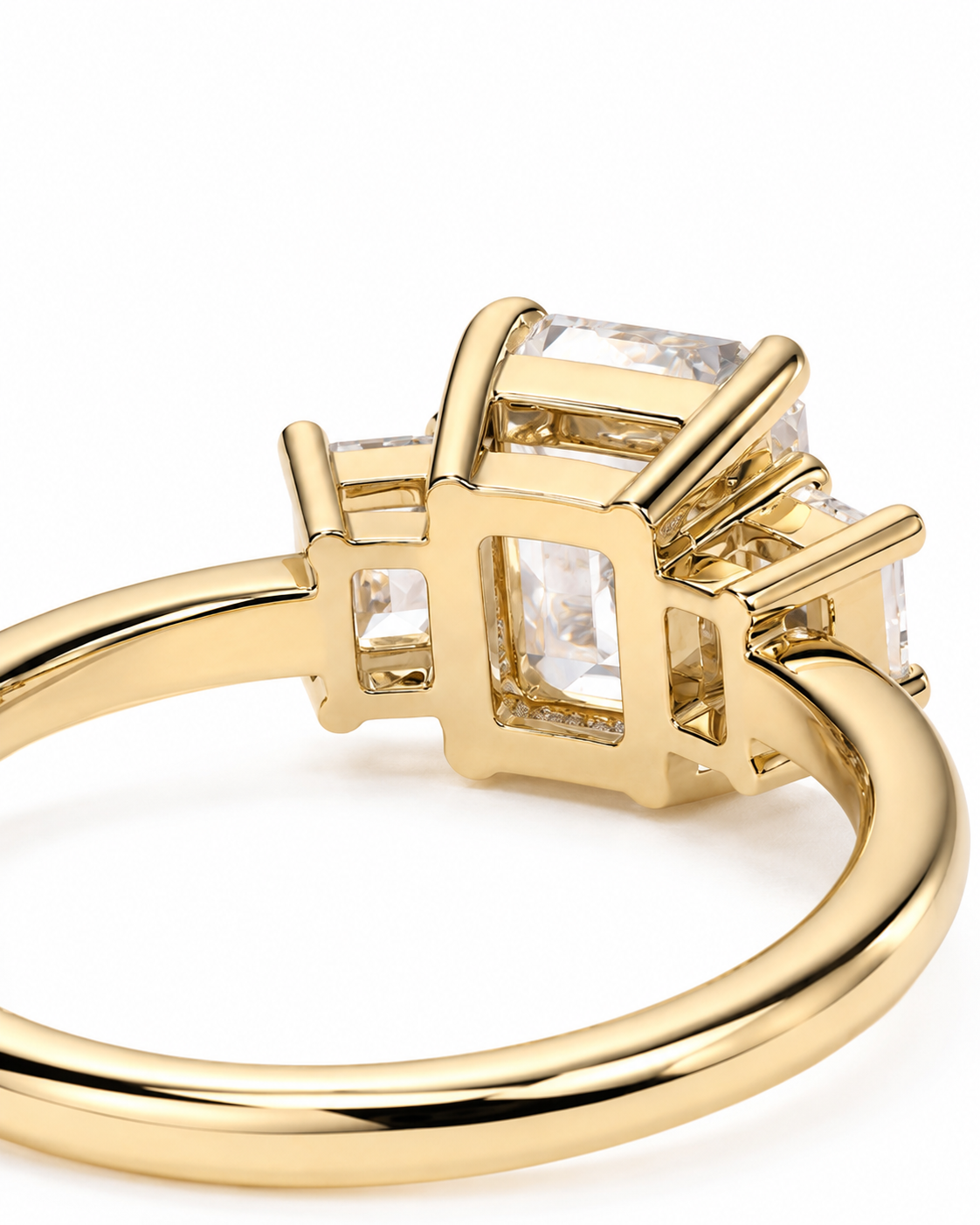color_10K_YG, color_14K_YG &&A close-up of a yellow gold ring featuring a square cluster setting with clear rectangular gemstones, shown against a plain white background.