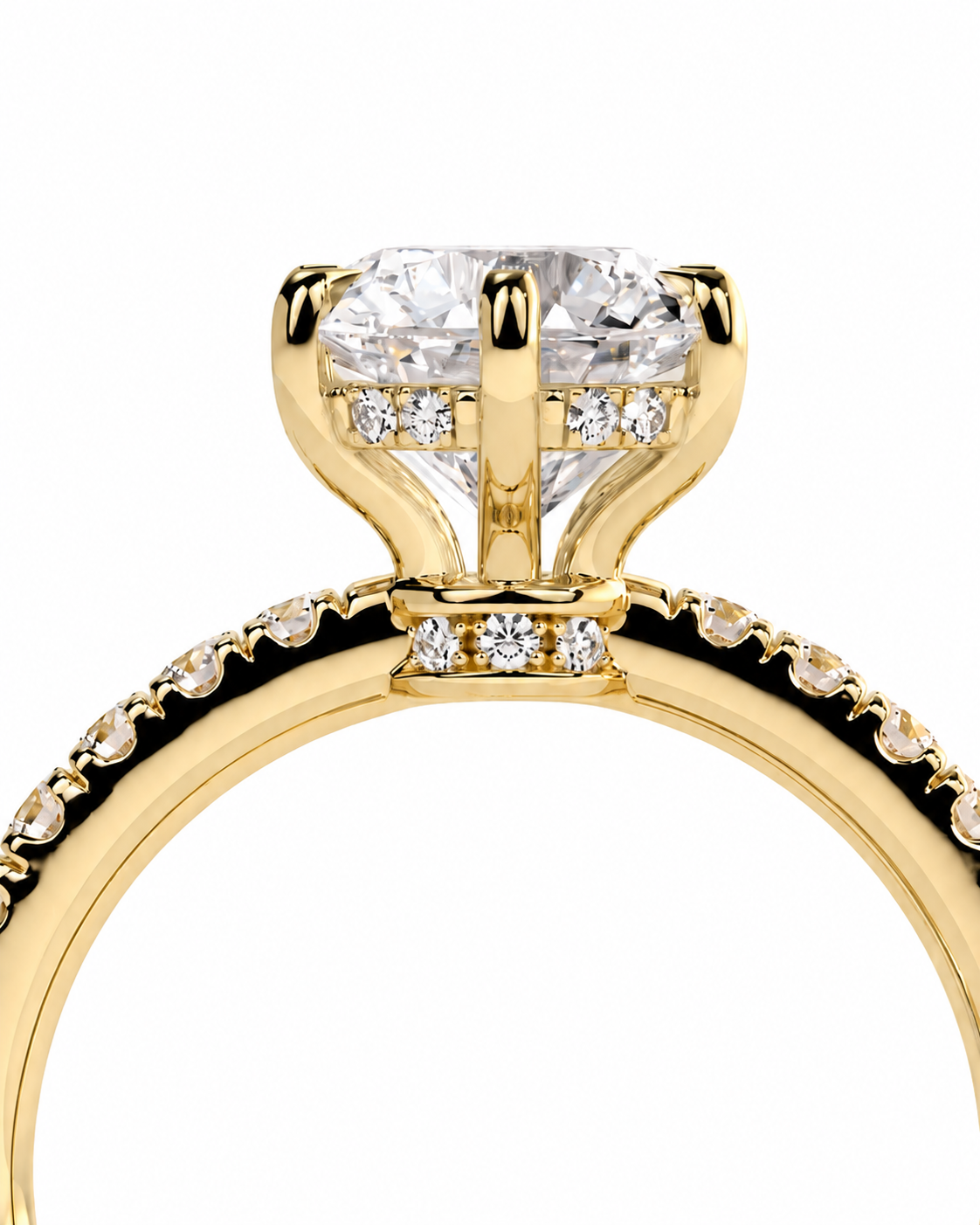 color_10K_YG, color_14K_YG &&A close-up of a yellow gold engagement ring featuring a large round brilliant-cut center stone in a four-prong setting, accented by smaller diamonds along the shoulders on a white background.