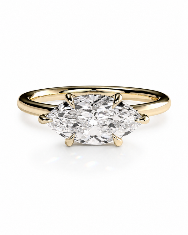 color_10K_YG, color_14K_YG &&A yellow gold ring featuring a large marquise-cut diamond in a four-prong setting, shown against a clean white background.