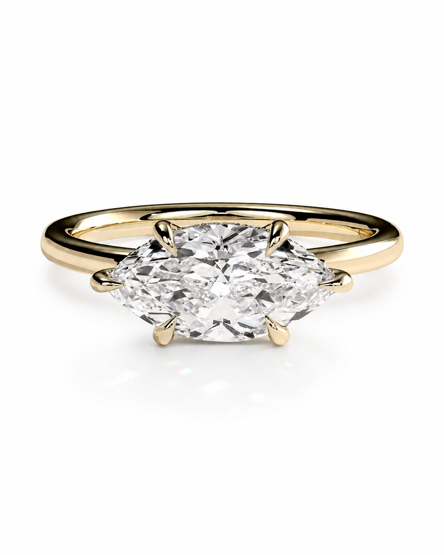 color_10K_YG, color_14K_YG &&A yellow gold ring featuring a large marquise-cut diamond in a four-prong setting, shown against a clean white background.