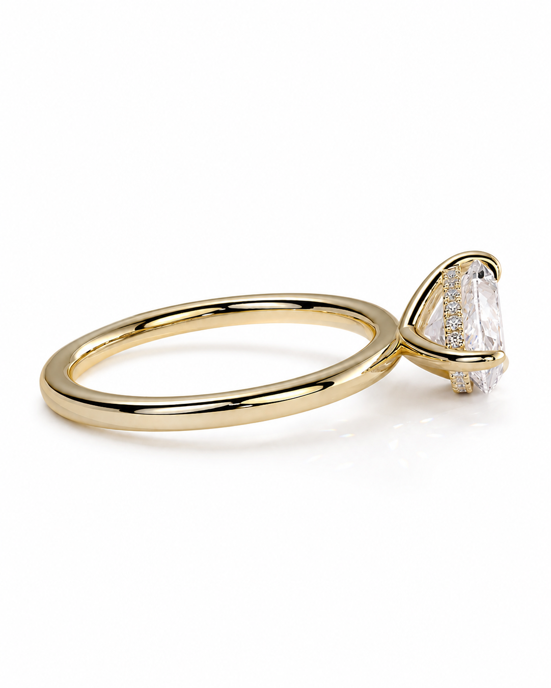 color_10K_YG, color_14K_YG &&A gold ring with a triangular bezel setting holding a clear marquise-cut gemstone, photographed on a clean white background.