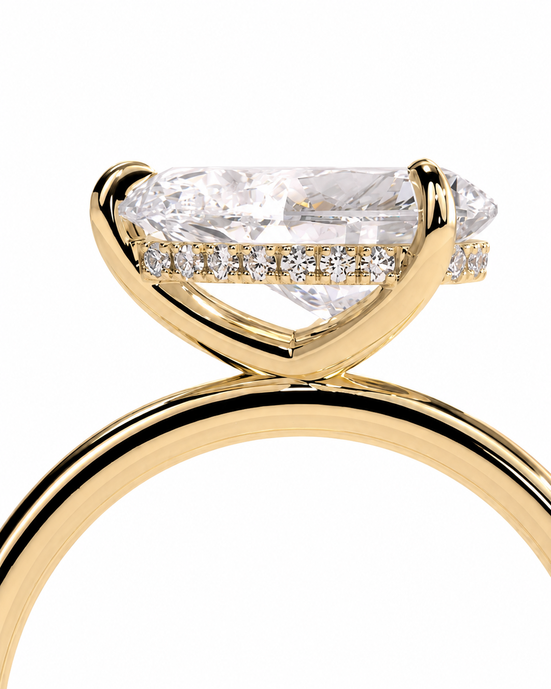 color_10K_YG, color_14K_YG &&A close-up of a yellow gold ring featuring a marquise-cut clear center stone and a row of small pavé diamonds along the band, set against a plain white background.