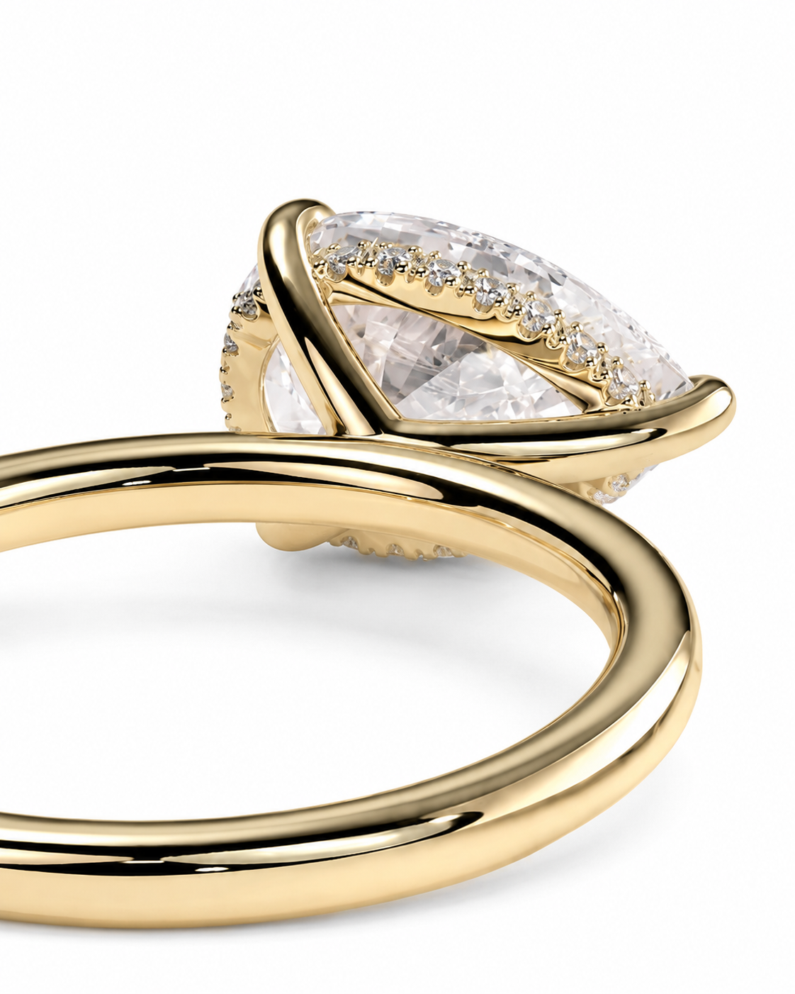 color_10K_YG, color_14K_YG &&A close-up of a gold ring featuring a large marquise-cut clear gemstone in a curved wrap setting, accented with small pavé diamonds, on a white background.