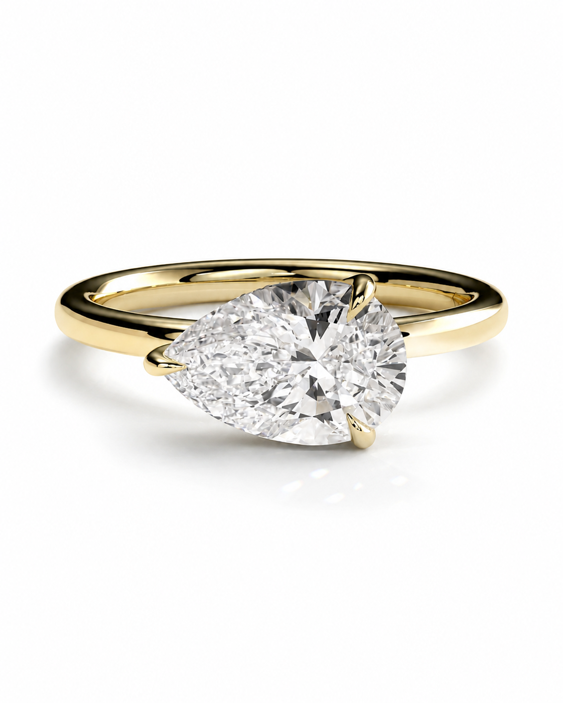 color_10K_YG, color_14K_YG &&A pear-cut diamond engagement ring with a yellow gold band, shown on a clean white background.