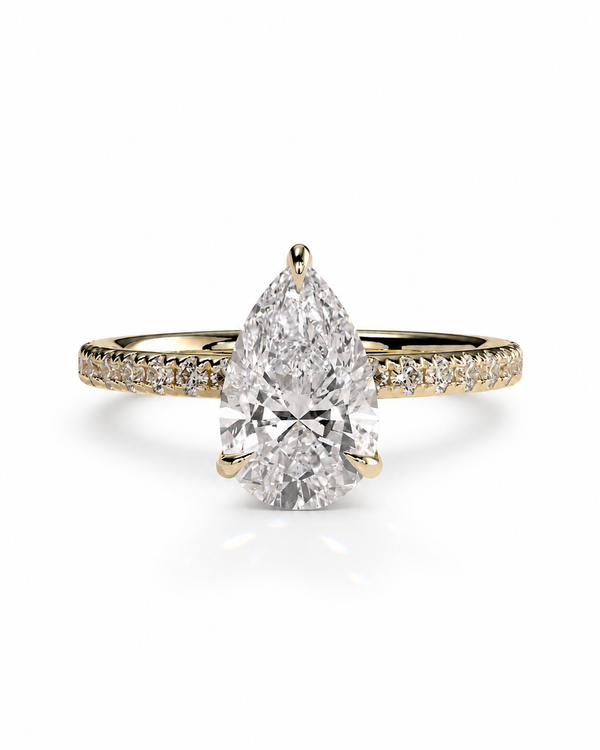 color_10K_YG, color_14K_YG &&A pear-cut diamond engagement ring with a yellow gold band accented by small pavé diamonds, shown on a clean white background.