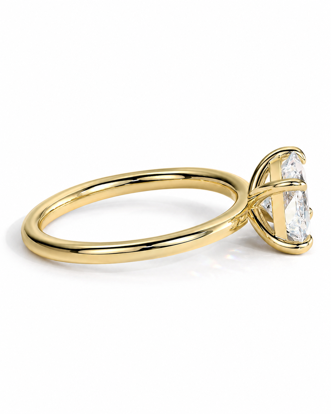 color_10K_YG, color_14K_YG &&A yellow gold ring with a large, clear, marquise-cut gemstone in a prong setting, shown from a side profile on a clean white background.
