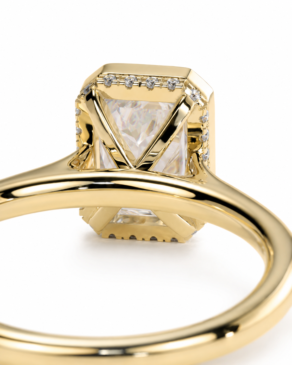 color_10K_YG, color_14K_YG &&
A close-up shot of a yellow gold ring featuring a large rectangular clear gemstone with a geometric crisscross pattern on the top, surrounded by small accent diamonds, set against a plain white background.