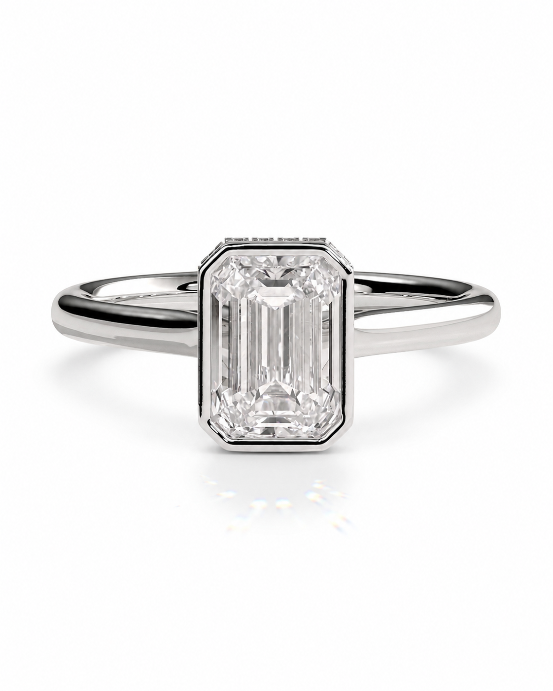 color_925_SIL,color_935_ARG,color_10K_WG, color_14K_WG &&
An emerald-cut diamond engagement ring in a silver-toned metal band, centered on a clean white background.
