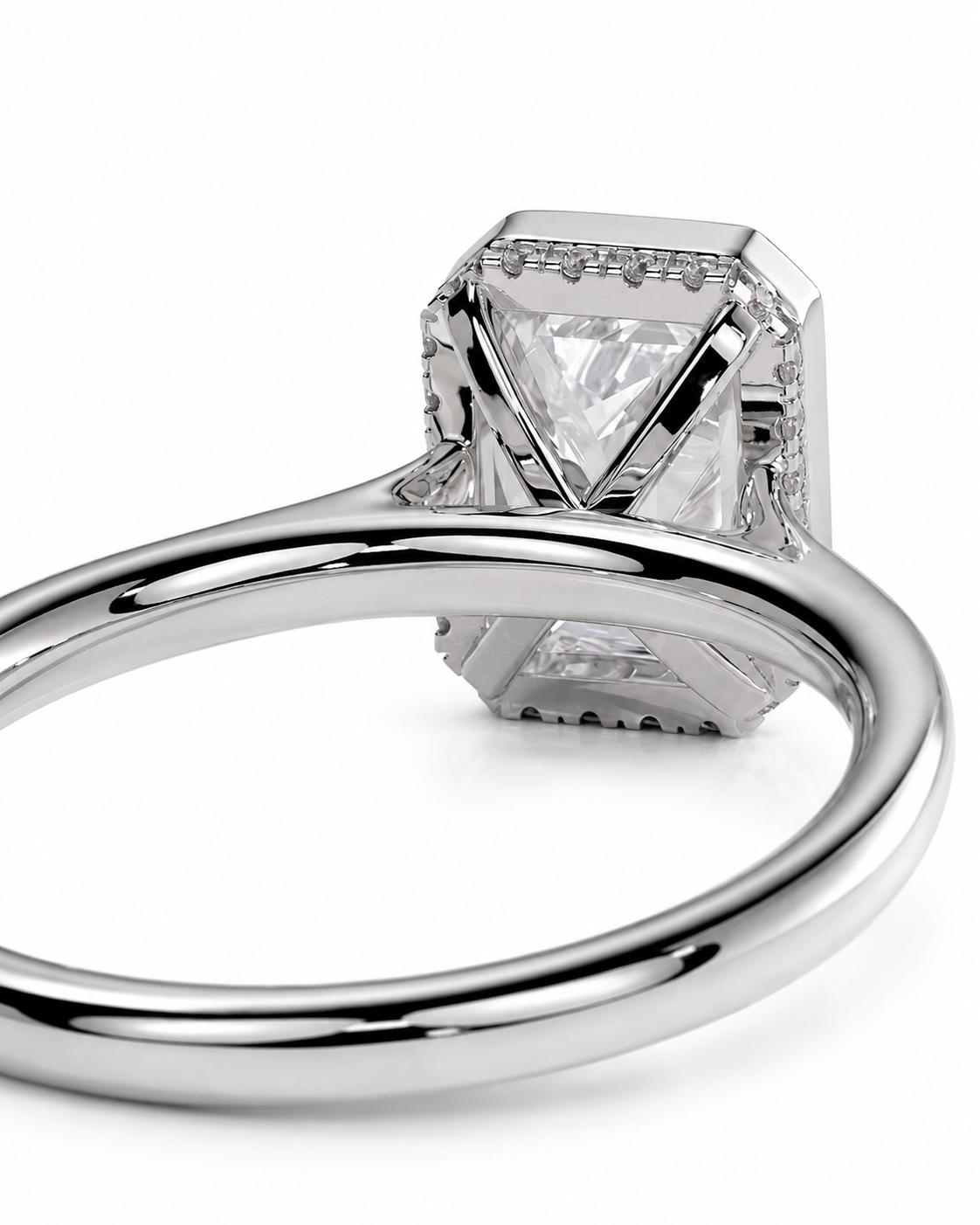 color_925_SIL,color_935_ARG,color_10K_WG, color_14K_WG &&
A close-up shot of a silver-toned diamond ring showing the back of the setting with a large triangular-cut center stone and smaller accent stones, on a white background.