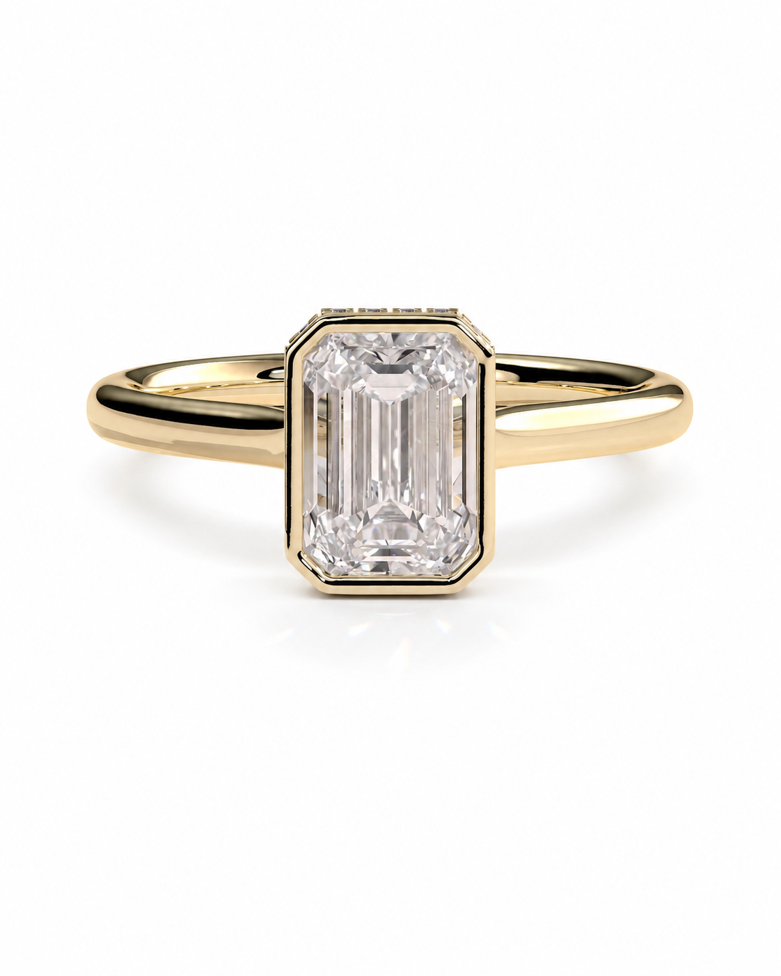 color_10K_YG, color_14K_YG &&
A yellow gold ring featuring a rectangular baguette-cut clear gemstone in a beveled setting, shown on a clean white background.