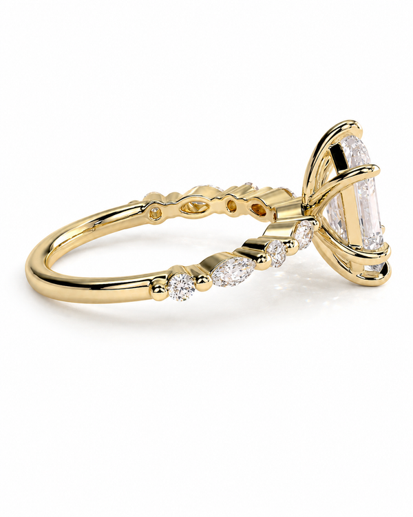 color_10K_YG, color_14K_YG &&A yellow gold ring featuring a large marquise-cut clear gemstone in a prong setting, accented by smaller round and oval clear stones along the band, shown on a clean white background.